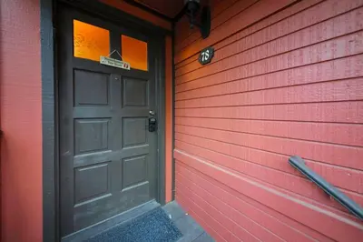 a red house with a door with a sign on it at Spa Steps to Lift Private Spa BBQ Massage Chair in Big Bear Lake