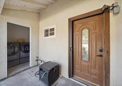 a front door of a house with a washing machine at Charming pet friendly family getaway Santa Clarita in Santa Clarita