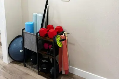 a room with a rack filled with red items at Modern Home Near Ontario Airport in Ontario