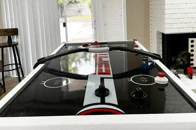 a race car on a table in a living room at Modern Home Near Ontario Airport in Ontario