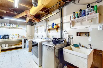 a dirty kitchen with a stove and a sink at Idyllic Cabin in the Woods Cozy Crestline Retreat in Arrowhead Highlands