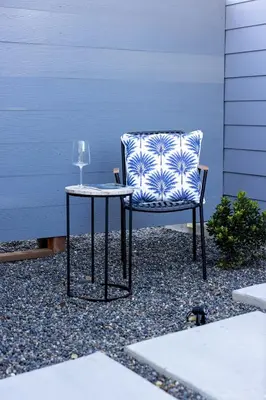 a chair and a table with a wine glass at Hollywood Family Nest in Burbank, Steps to Studios! in Burbank