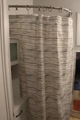 a bathroom with a shower curtain in a room at Private Room with Laundry and Pool access in Riverside