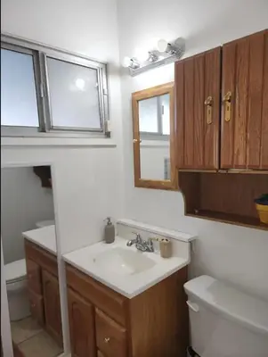 a bathroom with a sink and a toilet at Private Room with Laundry and Pool access in Riverside