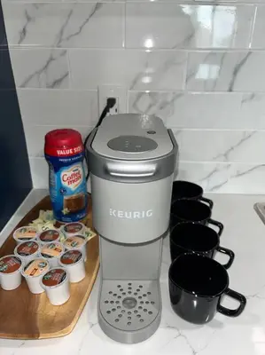 a kitchen counter with a mixer and some cupcakes at Lux Cozy Experience Elegance in San Bernardino