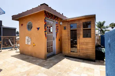 a small house with a door in a yard at Artsy Venice Beach Canals Studio w/Rooftop & Sauna in Los Angeles