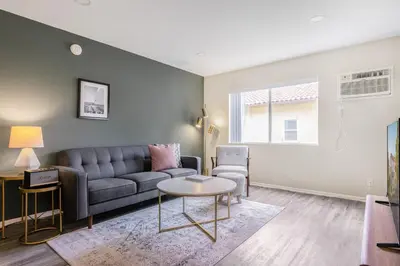 a living room with a couch and a table at Hollywood 1BR w pool nr Griffith Park trails LAX-117 in Los Angeles