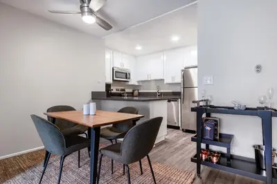a kitchen with a table and chairs in a room at Hollywood 1BR w pool nr Griffith Park trails LAX-117 in Los Angeles