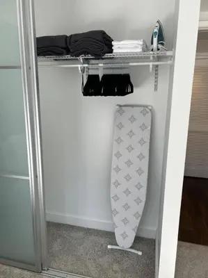 a closet with a shelf and a surfboard on it at Downtown LA - Mamba Suite - Free Indoor Parking! in Los Angeles