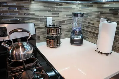 a kitchen counter with a stove and a blender at Downtown LA - Mamba Suite - Free Indoor Parking! in Los Angeles