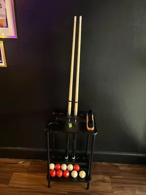 a black end table with three balls and chopsticks at Downtown LA - Mamba Suite - Free Indoor Parking! in Los Angeles