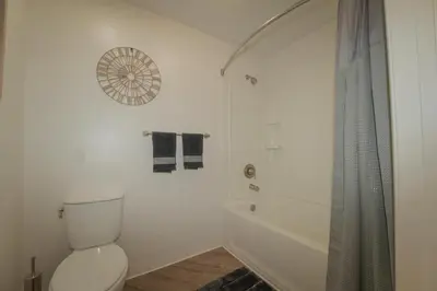 a white bathroom with a toilet and a shower at 2 bed in Marina Del Rey- Flash holiday deal! in Los Angeles