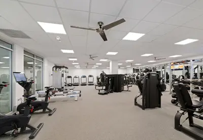 a gym with lots of exercise equipment and a ceiling fan at 2 bed in Marina Del Rey- Flash holiday deal! in Los Angeles