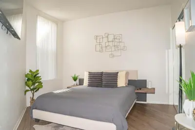 a bedroom with a bed and a chandelier at 2 bed in Marina Del Rey- Flash holiday deal! in Los Angeles