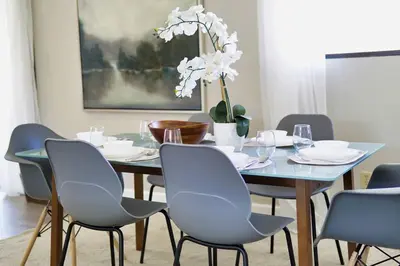 a dining room with a blue table and chairs at Oakridge Ranch ※ Sequoia, Kern River & Lake Escape in Lake Isabella