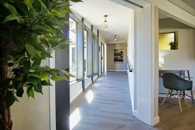 a hallway of a house with a chair and a table at Oakridge Ranch ※ Sequoia, Kern River & Lake Escape in Lake Isabella