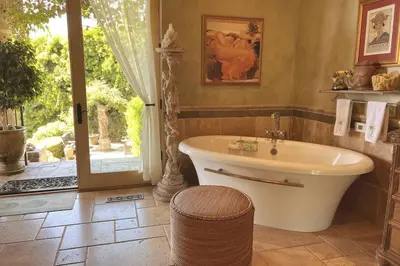 a bathroom with a bath tub and a window at Malibu by the Sea - 5-STARS! in Solromar