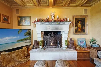 a living room with a fireplace and a couch at Malibu by the Sea - 5-STARS! in Solromar