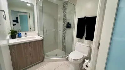 a bathroom with a shower and a toilet and a sink at Century City Cozy 3 Bedroom Apartment with Parking 302,303 in Los Angeles