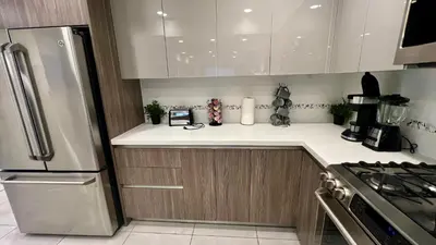 a kitchen with white counter tops and a refrigerator at Century City Cozy 3 Bedroom Apartment with Parking 302,303 in Los Angeles