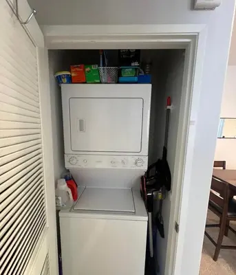 a small kitchen with a white microwave in a room at Canyon Country Cozy Apartment, Pool and Jacuzzi in Santa Clarita