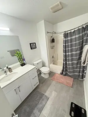 a bathroom with a sink and a toilet and a shower at Canyon Country Cozy Apartment, Pool and Jacuzzi in Santa Clarita