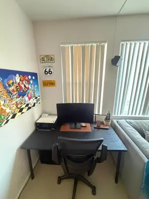 an office with a desk with a laptop computer on it at Canyon Country Cozy Apartment, Pool and Jacuzzi in Santa Clarita