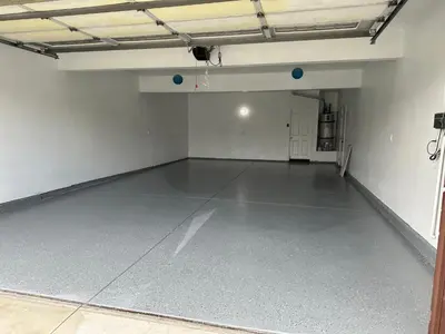 an empty garage with a concrete floor in it at ALE Displaced, Relocation, Insurance, Fire, Flood in Corona