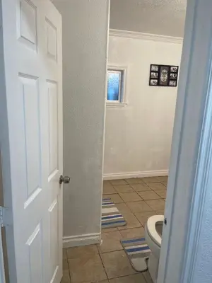 an open door to a bathroom with a toilet at Walking Distance Disney in Anaheim in Anaheim