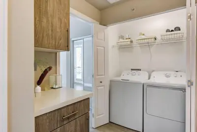 a kitchen with a white washer and dryer in it at Woodland Hills Luxury Apt 2 bed CA in Los Angeles