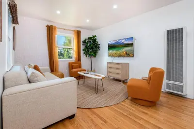 a living room with a couch and a table and chairs at Luxe 1-bedroom Gem: Venice Beach Escape in Los Angeles