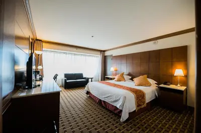 a hotel room with a bed and a television at LA Crystal Hotel -Los Angeles-Long Beach Area in Carson