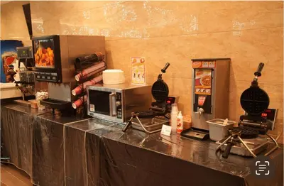 a counter top with a microwave and a counter top at LA Crystal Hotel -Los Angeles-Long Beach Area in Carson