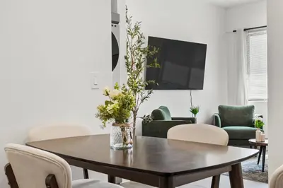 a living room with a table and chairs at Private Cozy Guest House, King Bed, Parking, Pet Friendly near Penmar Golf Course! in Los Angeles