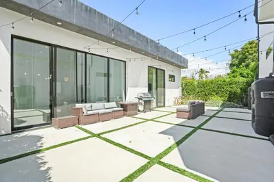 a patio of a house with glass doors at New Lavish Elegant 3BR Home in Mar Vista, Pet Friendly! 10min to Venice Beach! in Los Angeles