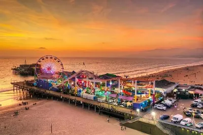 an amusement park and a ferris wheel on the beach at Scandinavian 2BR, 2Bath Townhome, Pet & Kid Friendly, Free Parking, 10min to Venice Beach! in Los Angeles