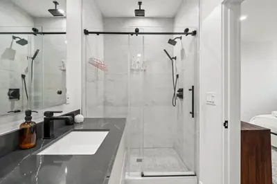 a bathroom with a shower and a sink at Scandinavian 2BR, 2Bath Townhome, Pet & Kid Friendly, Free Parking, 10min to Venice Beach! in Los Angeles