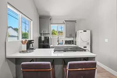 a kitchen with a counter and a stove top oven at New Modern Cozy Guest House, Parking, Pet Friendly in Mar Vista! in Los Angeles