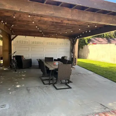 An Amazing comfortable home front middle unit 1q bed and other room with sofa