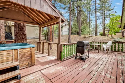 a deck with a grill and a barbecue on it at Pines and needles #1454 in Big Bear Lake