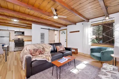 a living room with a couch and a table at Cozy fox #2035 in Big Bear Lake