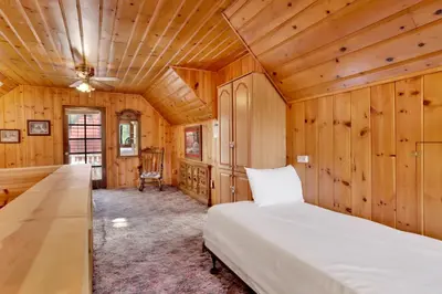 a bedroom with a bed and a wooden ceiling at Pine nest#2296 in Big Bear Lake