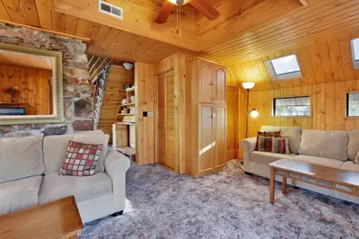 a living room with a couch and a table at Pine nest#2296 in Big Bear Lake