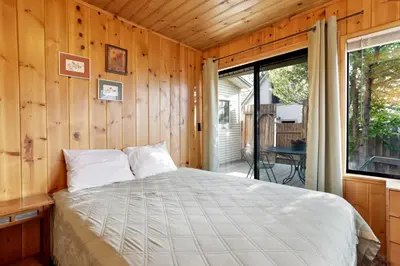 a bedroom with a bed in a room with a window at Pine nest#2296 in Big Bear Lake