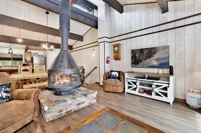 a living room with a large fireplace in a house at Smith summit chalet #2461 in Big Bear Lake