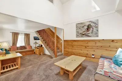 a living room with a couch and a table at Life of riley #1608 in Big Bear Lake