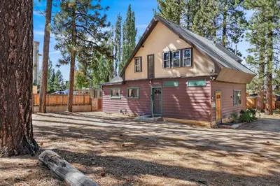 a house in the woods with a tree at JUS' RESTIN #265 in Big Bear Lake