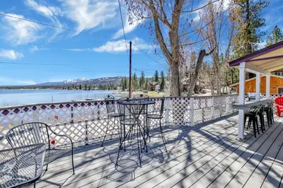 a deck with a table and chairs on a house at FRANK'S OLD BEAR #149 in Big Bear Lake