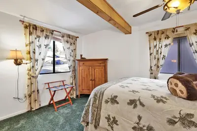 a bedroom with a bed and a window at Pleasant Pause#1864 in Fawnskin