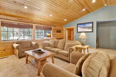a large living room with couches and a table at All about fun #1149 in Big Bear Lake
